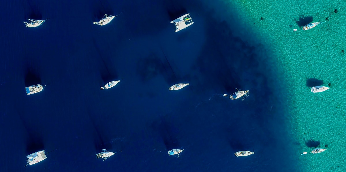 A group of boats moored in a lagoon