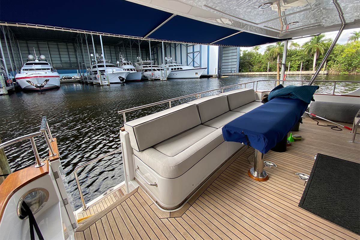 Paikea II exterior aft deck white diamond quilted faux leather and new awning