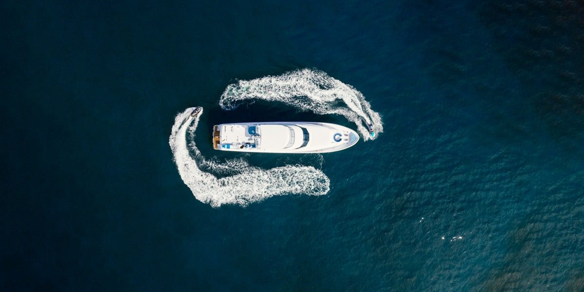 aerial view of yacht and jet skis